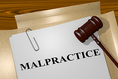 Legal malpractice -legal concept - gavel with files